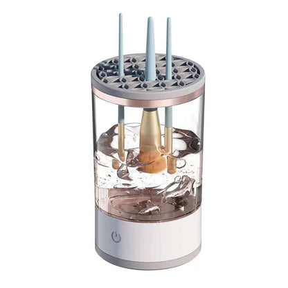 Electric makeup brush cleaner in use on vanity table lifestyle shot