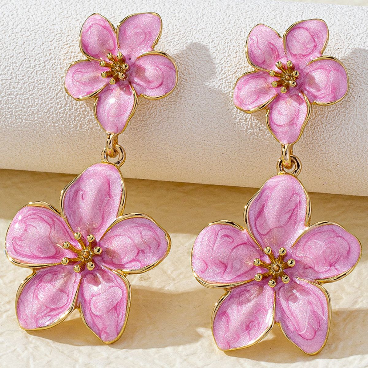 BloomDrop 18K gold plated resin earrings detail shot on ear