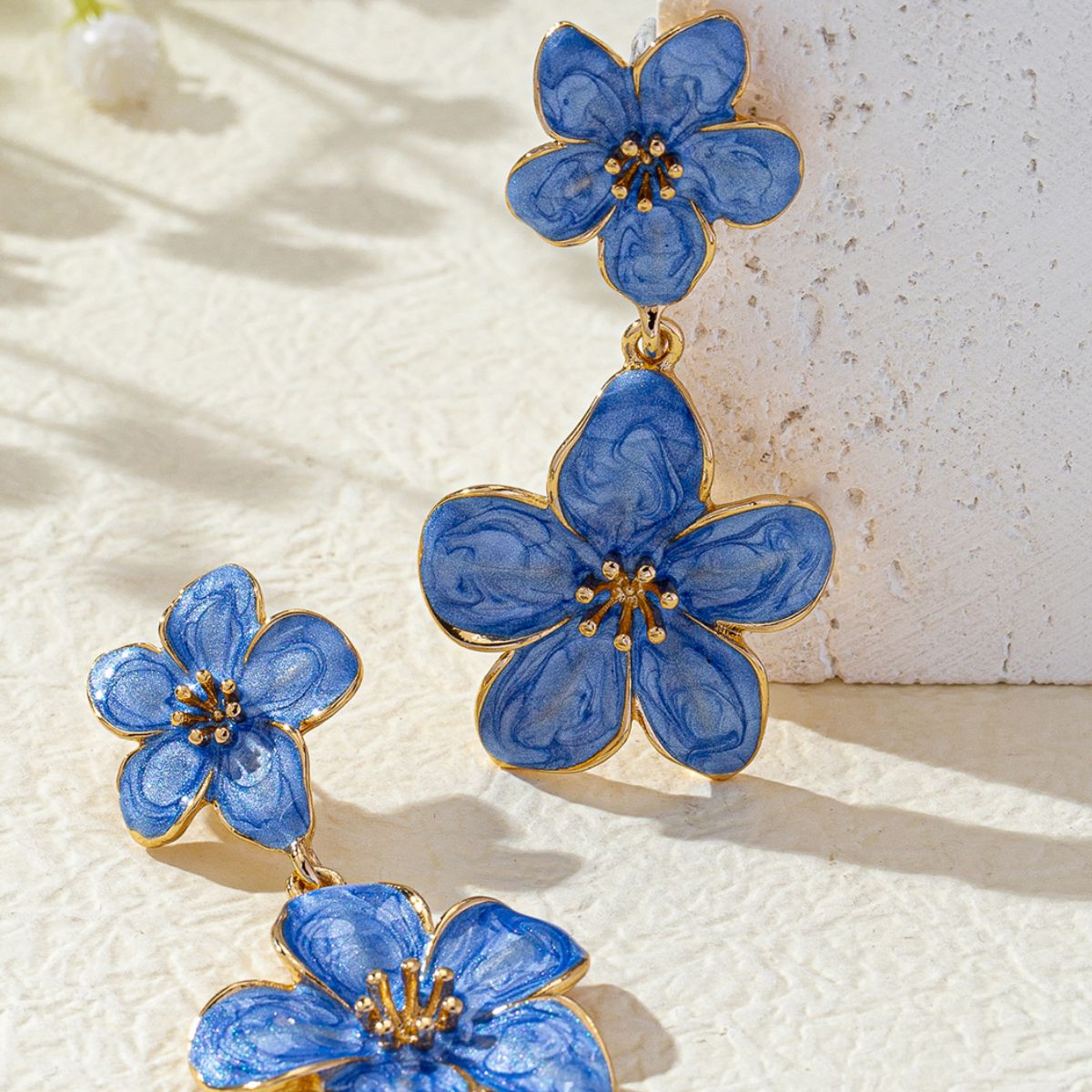 BloomDrop flower earrings lifestyle flat lay with accessories