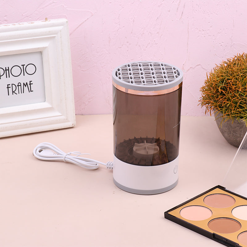Auto spin brush cleaner removing pigment from foundation brush